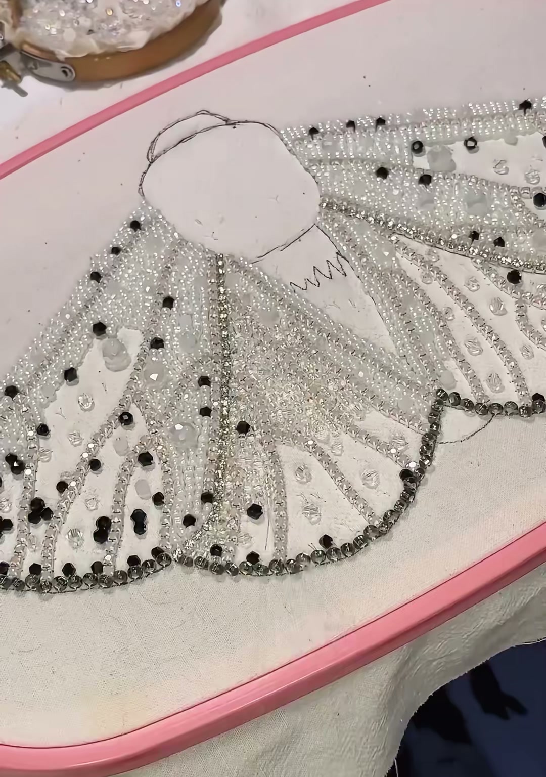 Step 12 — The fully beaded wings with the head and thorax area now outlined in silver beads and rhinestones
