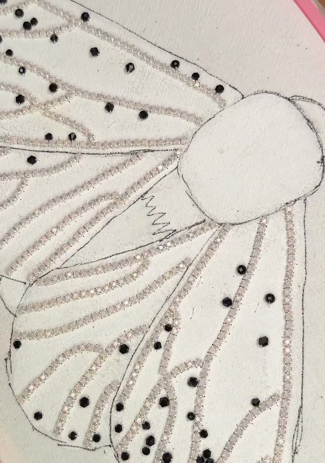 Step 05 — Black beads scattered across the silver veins like eyespots, creating a bold moth-wing pattern