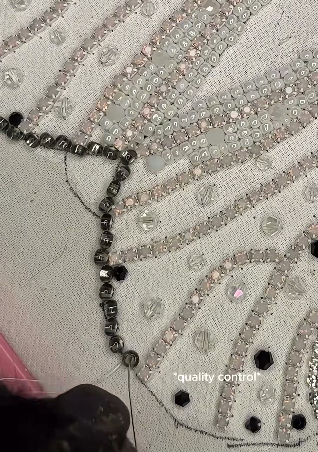 Step 11 — A row of dark beads being stitched along the outer edge of a wing, with the text "quality control" on screen