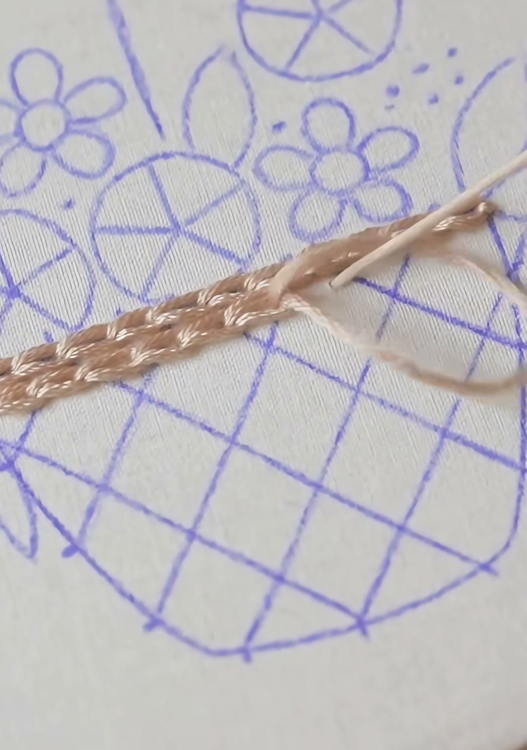 Step 02 — The basket body almost completely filled with close tan satin stitches