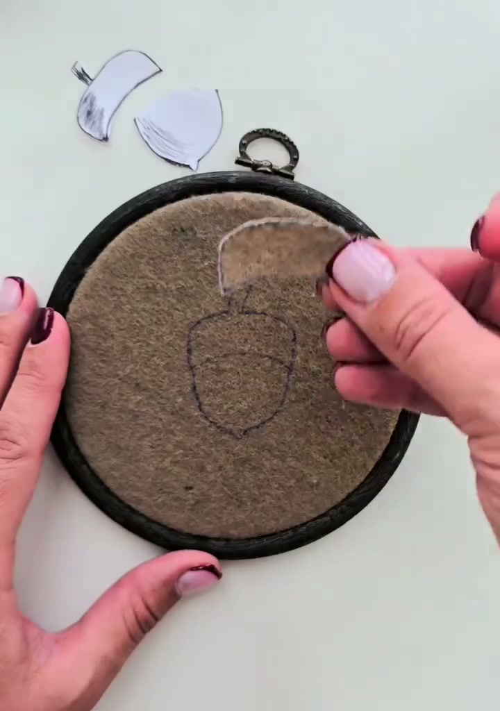 Step 06 — A hand tracing around the paper template with a marker