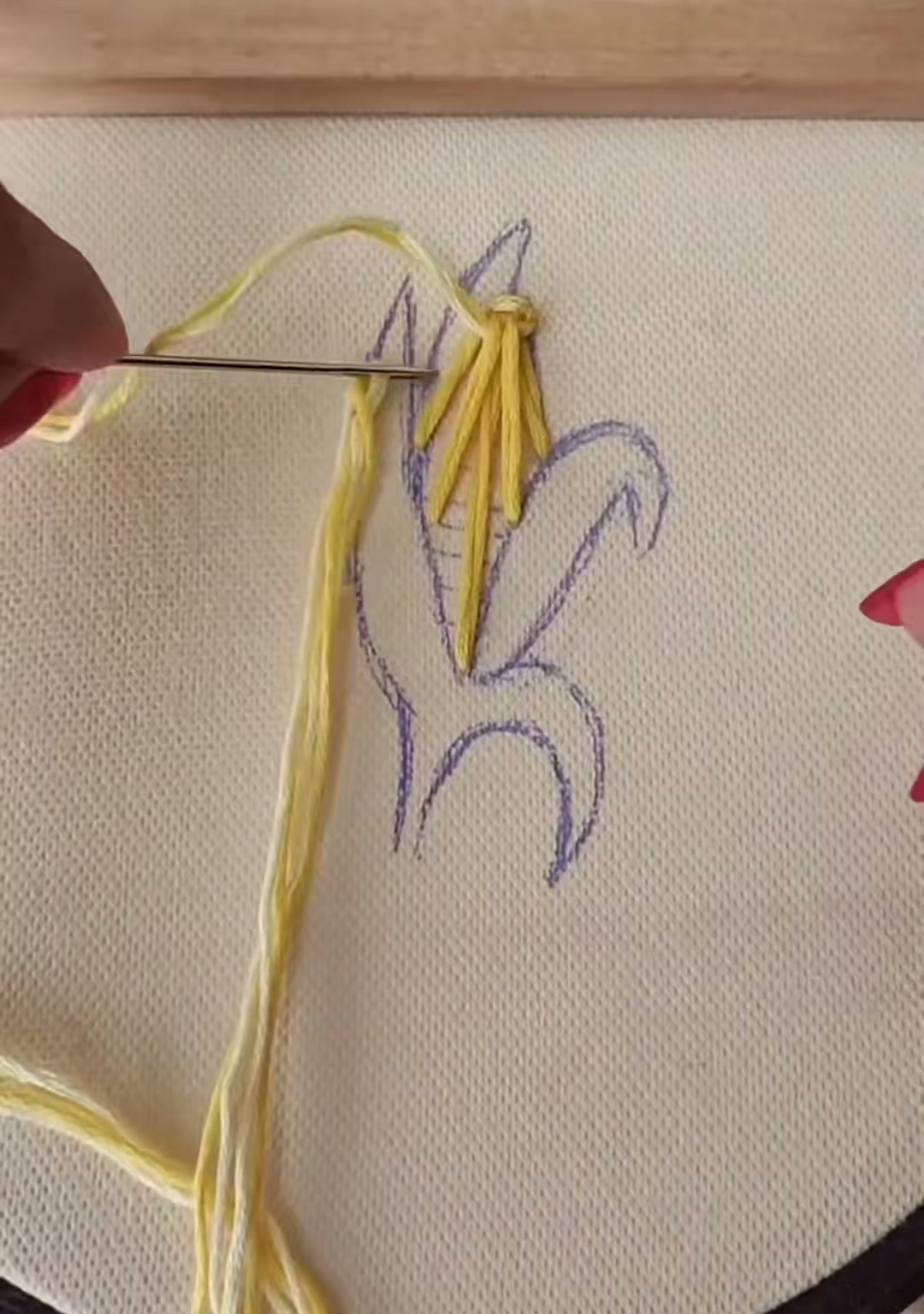 Step 4 — The corn ear now half-covered in dense yellow stitching, with the kernel texture starting to show