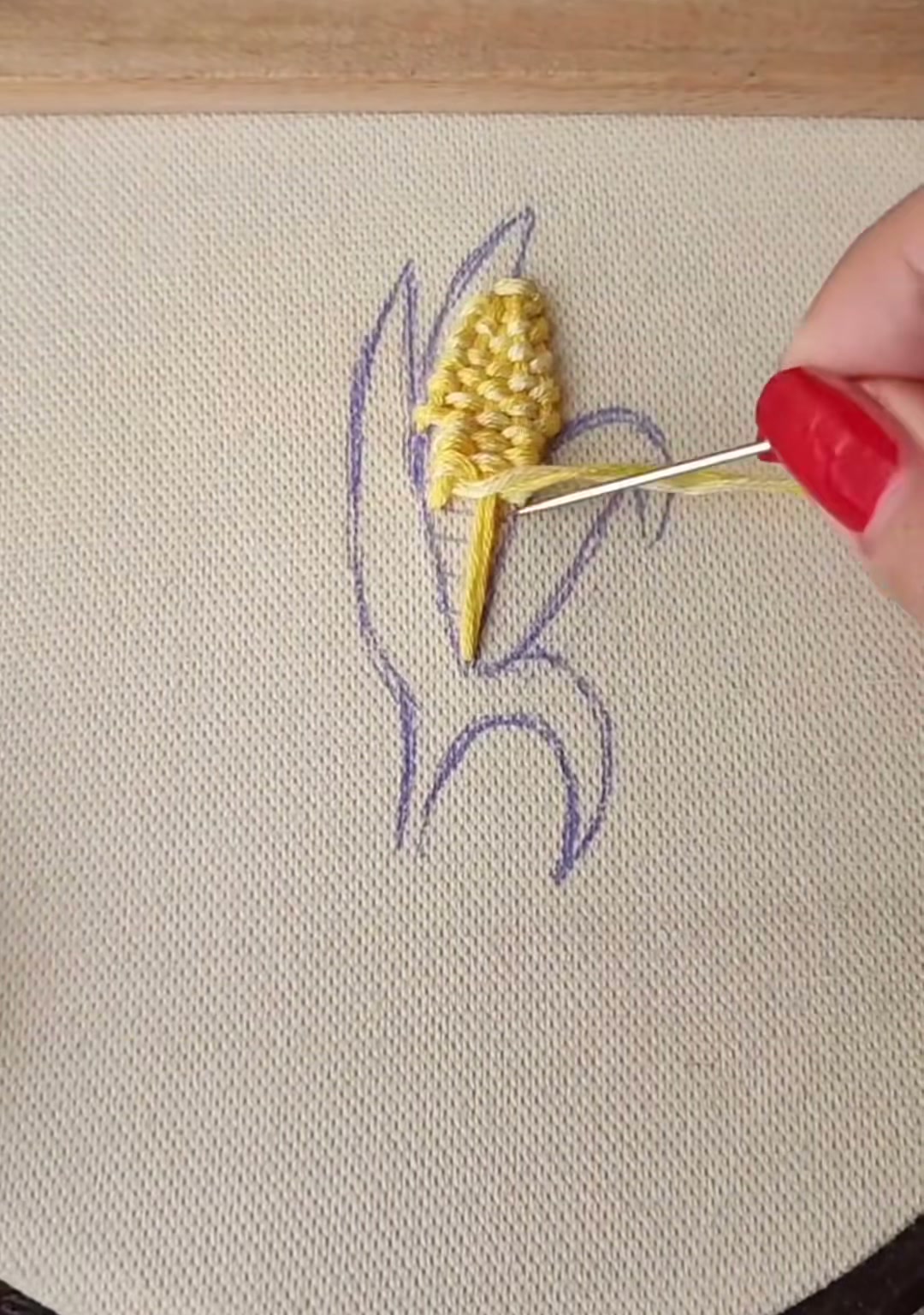 Step 5 — Close-up of the padded satin stitch building up the corn surface into a raised, rounded form
