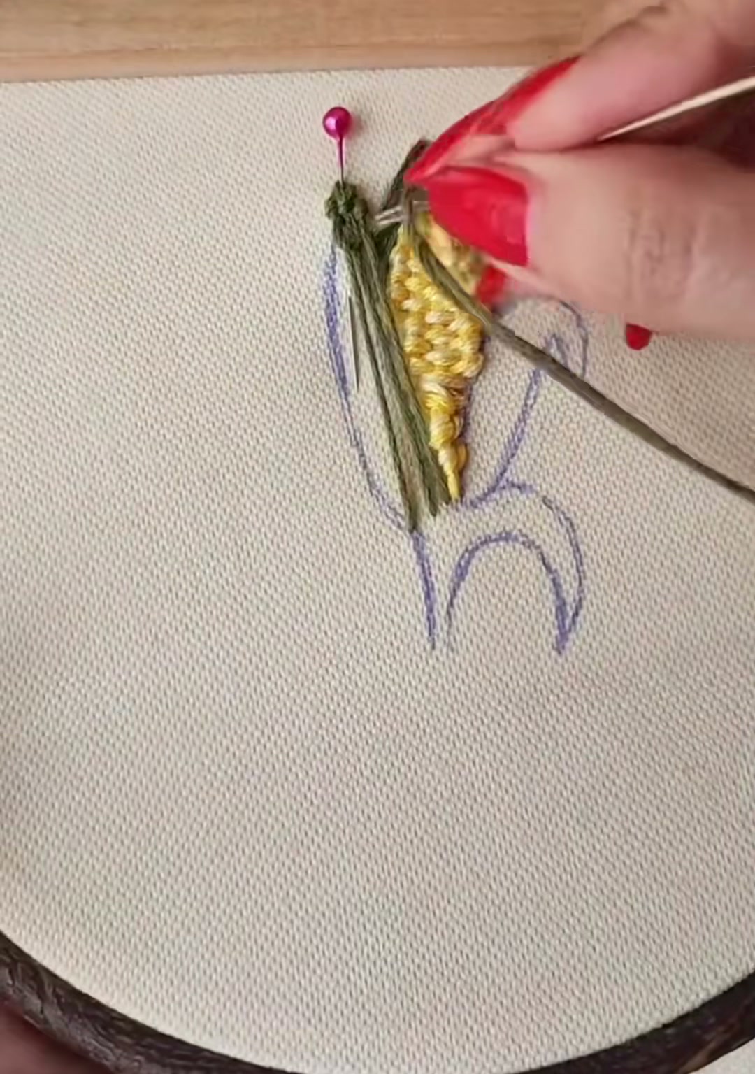 Step 11 — Close-up of the second husk being filled with smooth satin stitches
