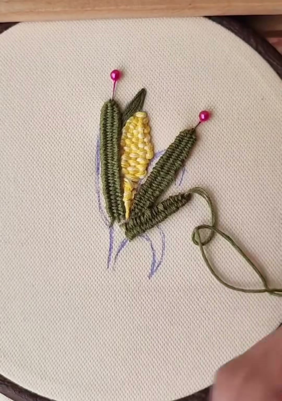 Step 13 — A small curled green leaf added at the base of the corn, giving the composition movement