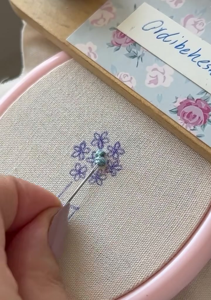 First tiny star flower nearly complete with several radiating stitches